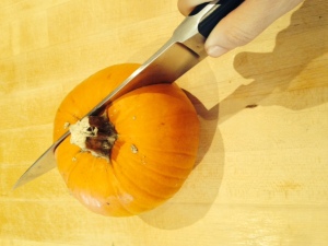 Use a large knife to cut your pumpkin. 